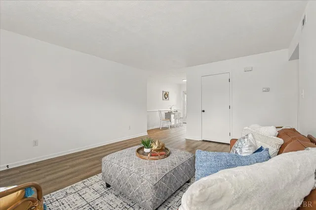 a living room with furniture and a table