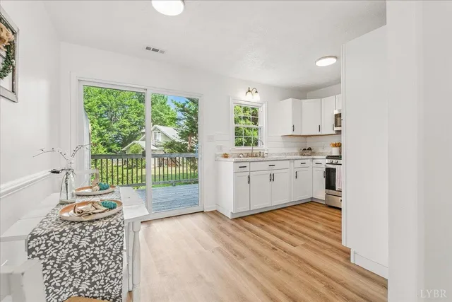 a kitchen with a stove a sink and a refrigerator