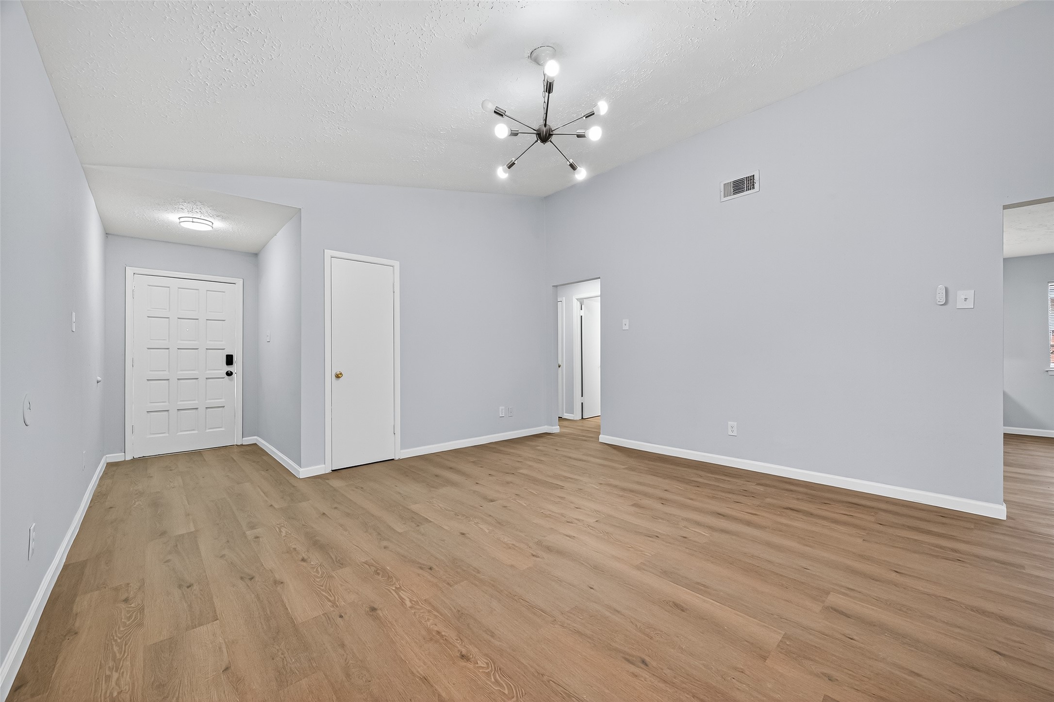 11622 Old Telegraph Road Houston, TX 77067 - Photo 11 of 38 a view of an empty room with wooden floor