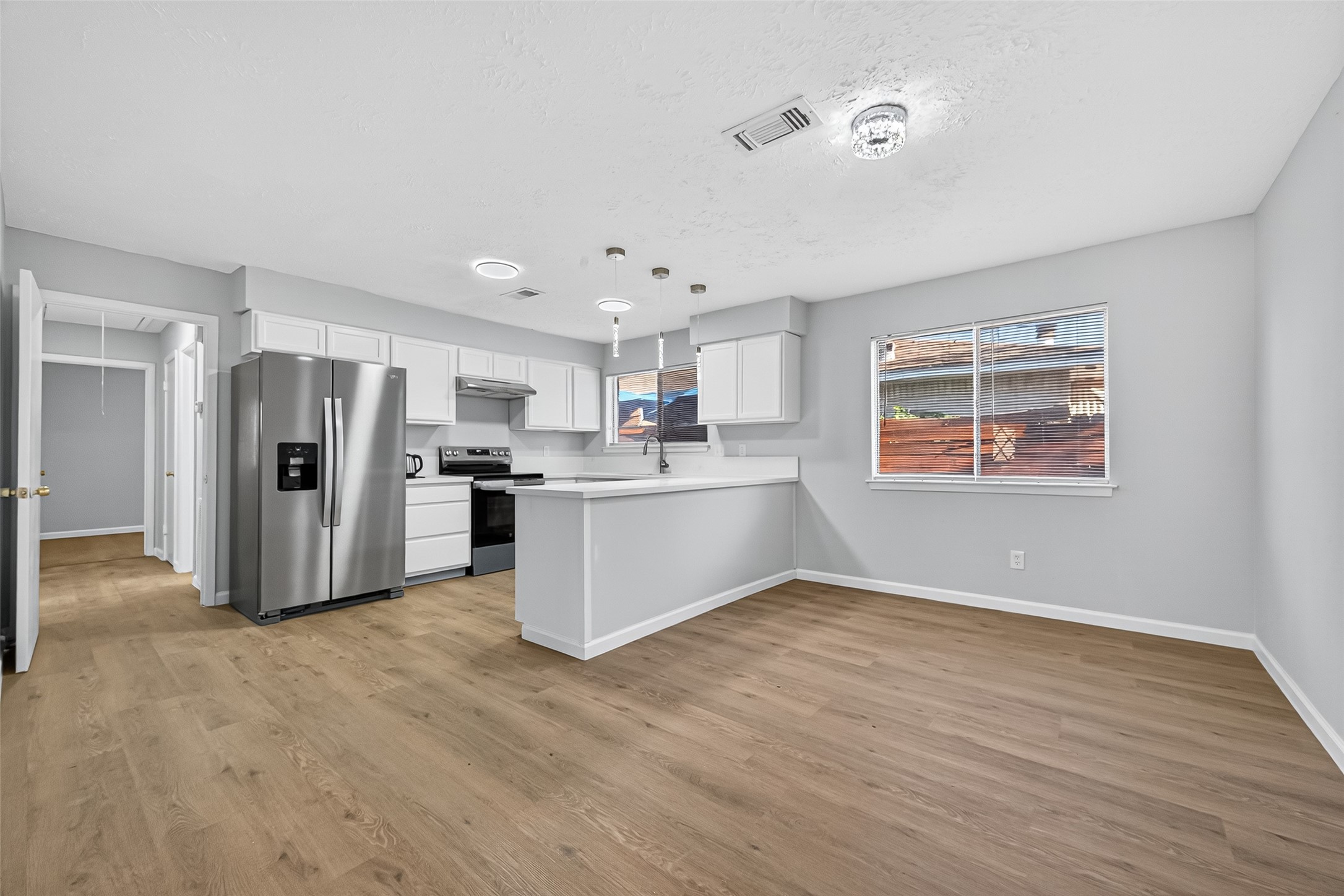 11622 Old Telegraph Road Houston, TX 77067 - Photo 15 of 38 a view of kitchen with stainless steel appliances refrigerator oven microwave and cabinets