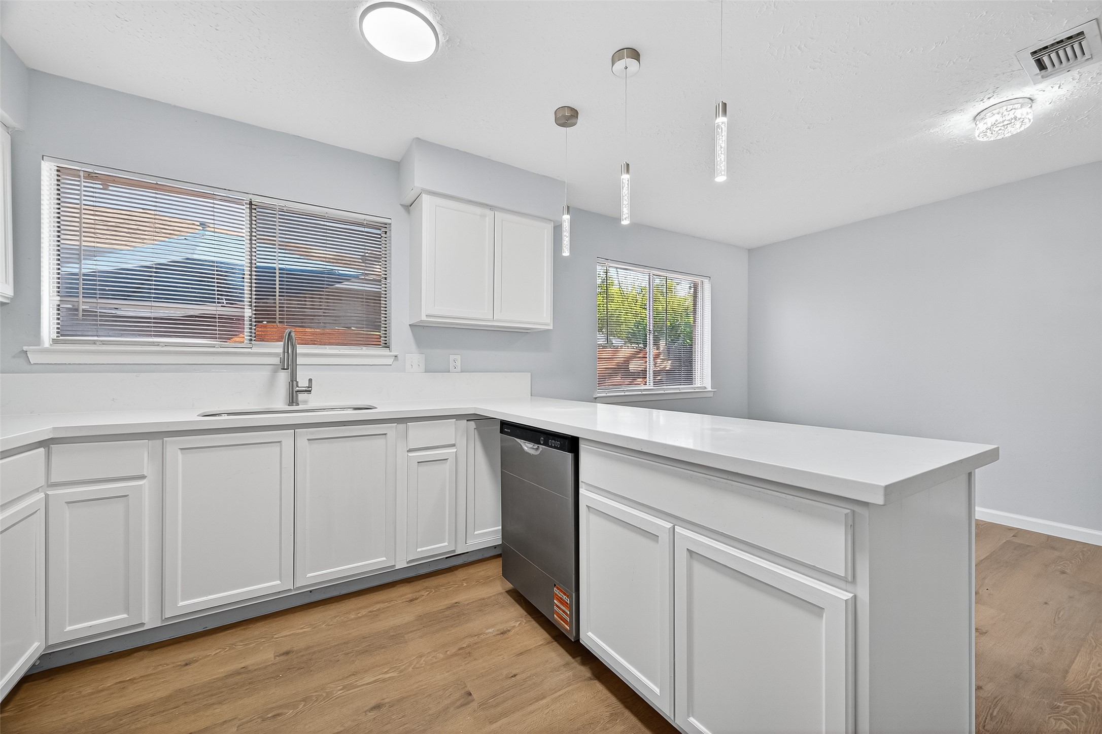 11622 Old Telegraph Road Houston, TX 77067 - Photo 24 of 38 a kitchen with white cabinets and sink