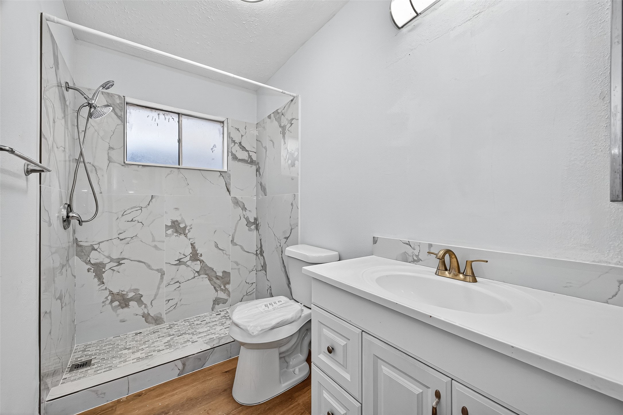11622 Old Telegraph Road Houston, TX 77067 - Photo 27 of 38 a bathroom with a shower toilet and sink