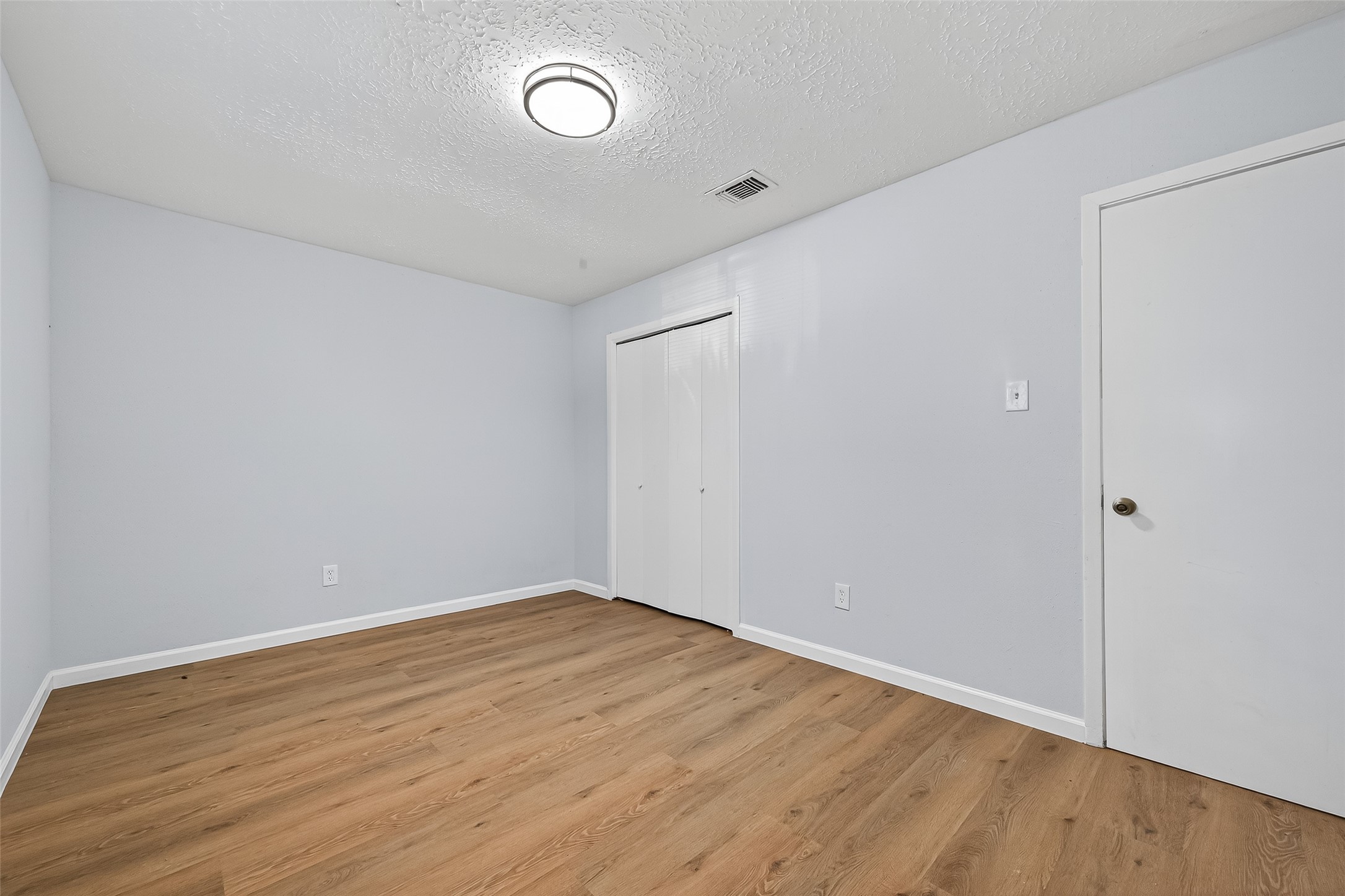11622 Old Telegraph Road Houston, TX 77067 - Photo 32 of 38 a view of an empty room with wooden floor