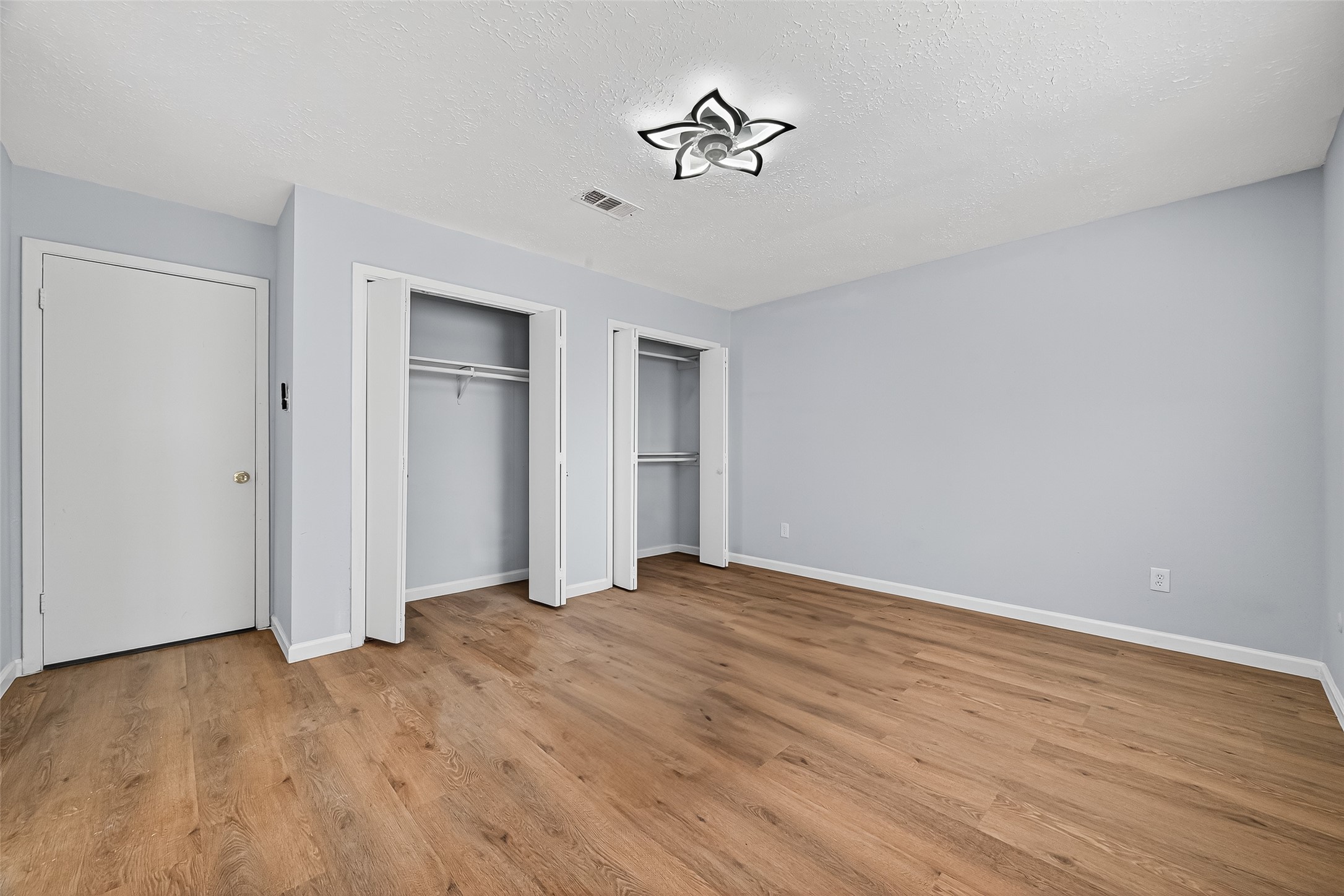 11622 Old Telegraph Road Houston, TX 77067 - Photo 34 of 38 a view of empty room with wooden floor