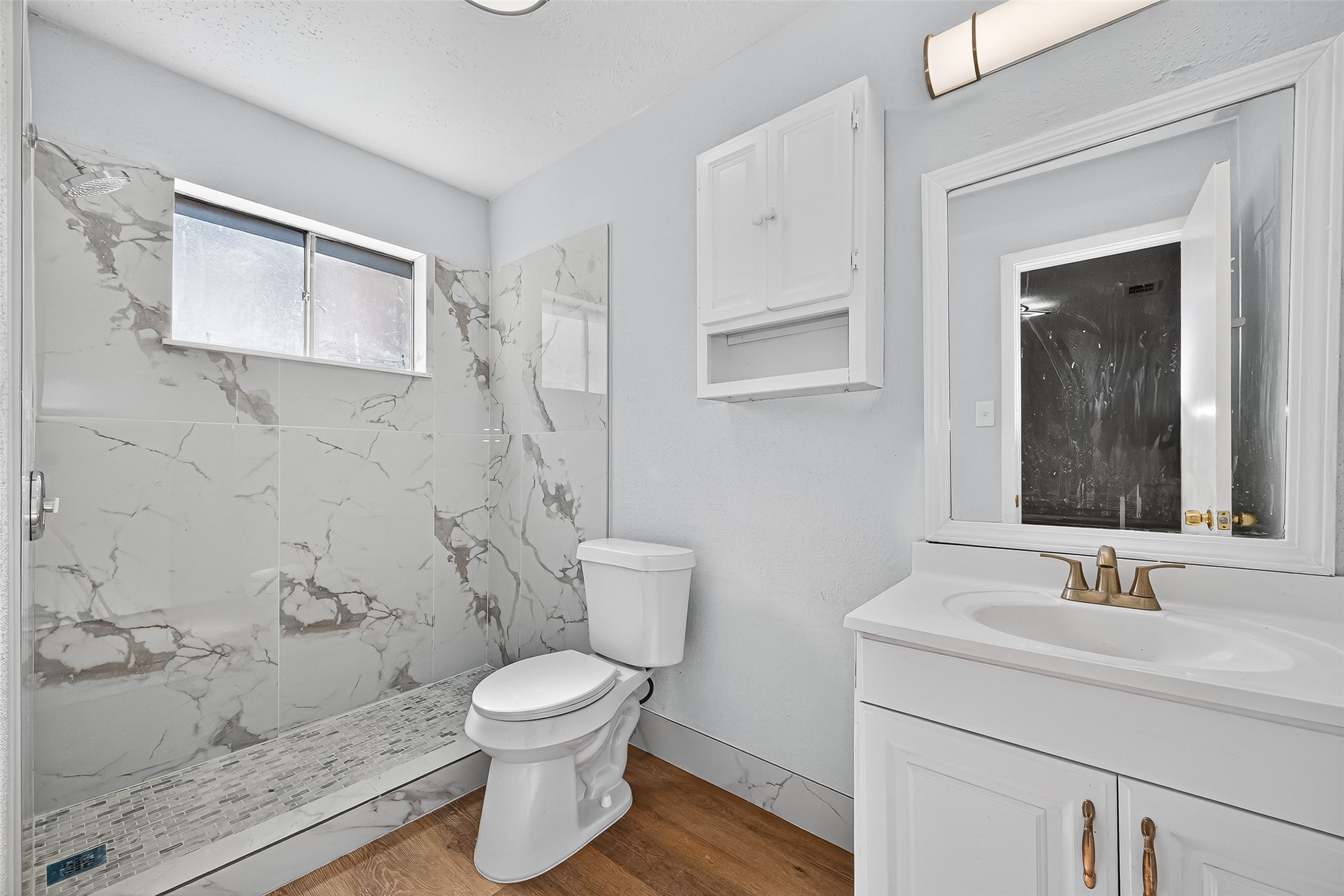 11622 Old Telegraph Road Houston, TX 77067 - Photo 36 of 38 a bathroom with a toilet a sink and mirror