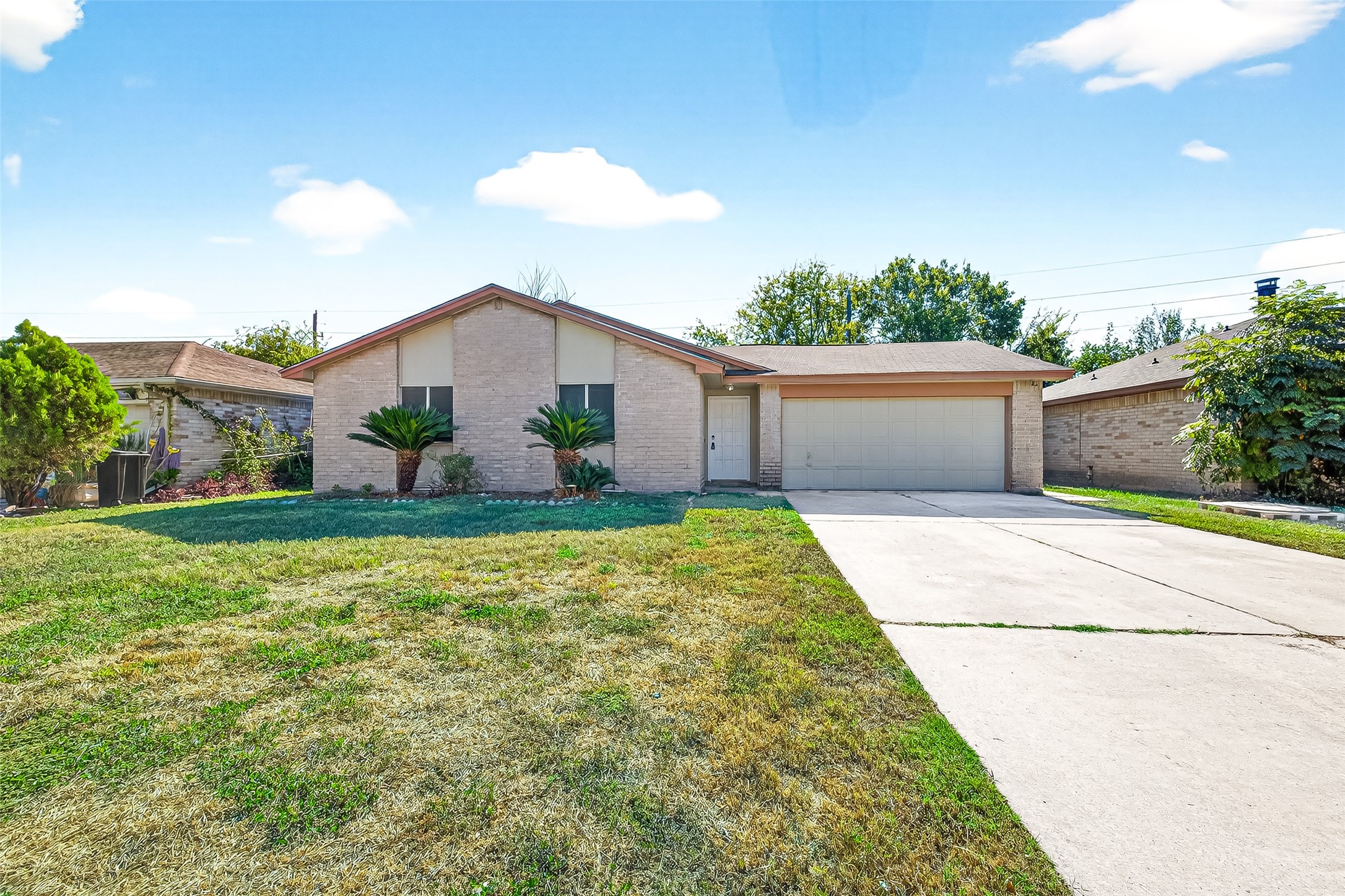 11622 Old Telegraph Road Houston, TX 77067 - Photo 4 of 38 a front view of a house with garden