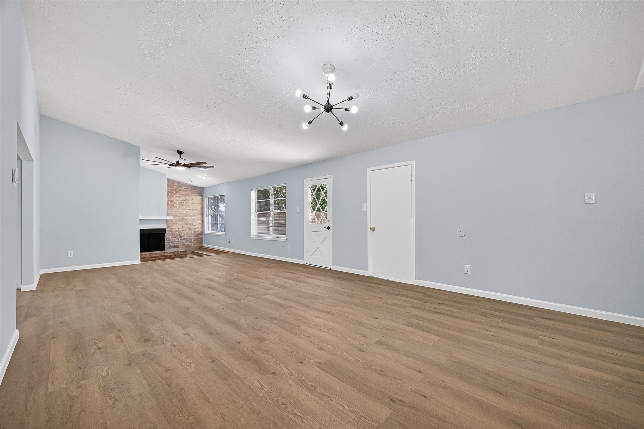 11622 Old Telegraph Road Houston, TX 77067 - Photo 8 of 38 a view of empty room with wooden floor and ceiling fan