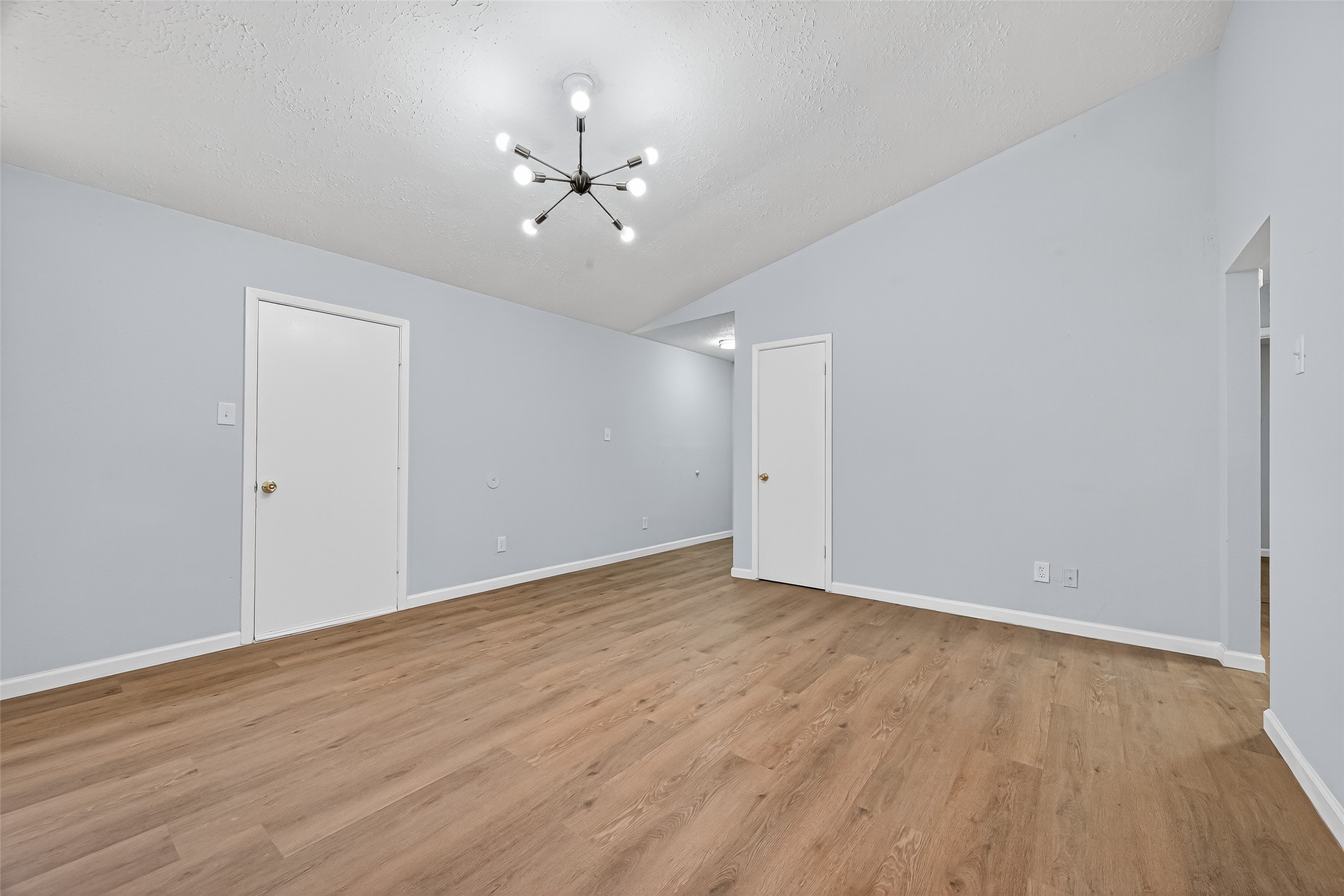 11622 Old Telegraph Road Houston, TX 77067 - Photo 9 of 38 a view of an empty room with wooden floor