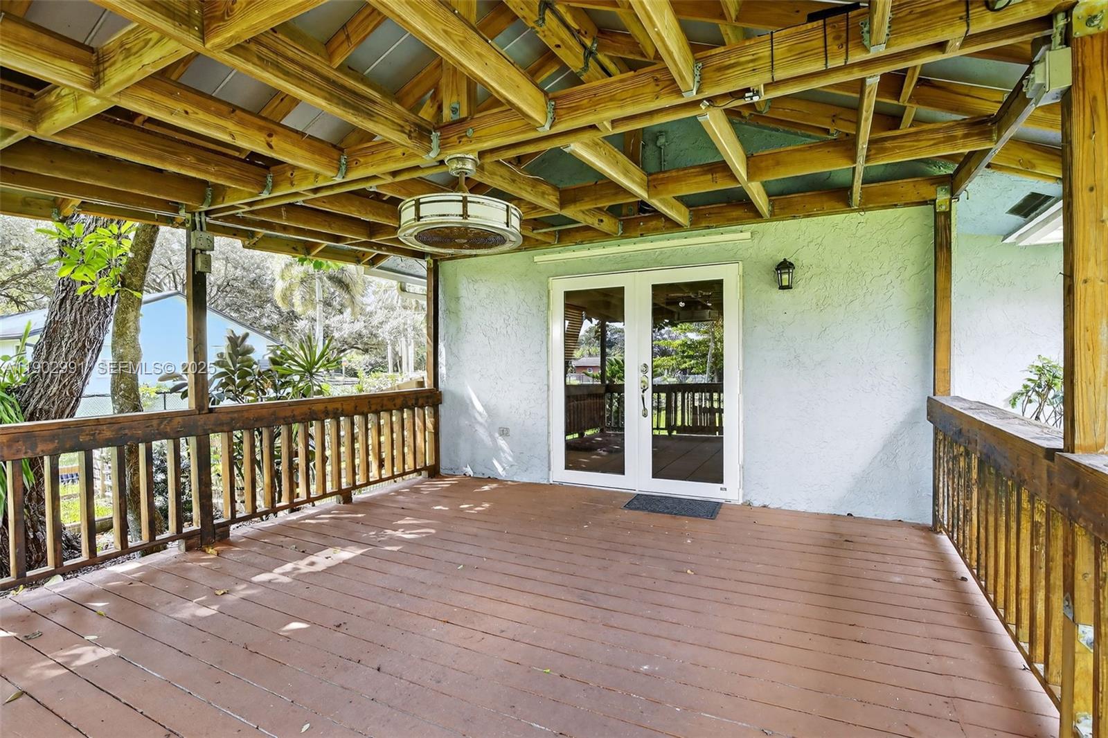 5010 Southwest 201st Terrace Southwest Ranches, FL 33332 - Photo 30 of 50 a view of a porch with wooden floor and stairs