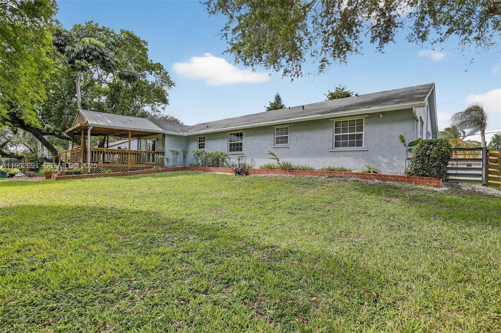 5010 Southwest 201st Terrace Southwest Ranches, FL 33332 - Photo 35 of 50 a front view of house with yard and green space