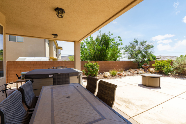2005 West 450 S Circle St. George, UT 84770 - Photo 36 of 57 Covered patio featuring an outdoor ceiling with two attached light fixtures