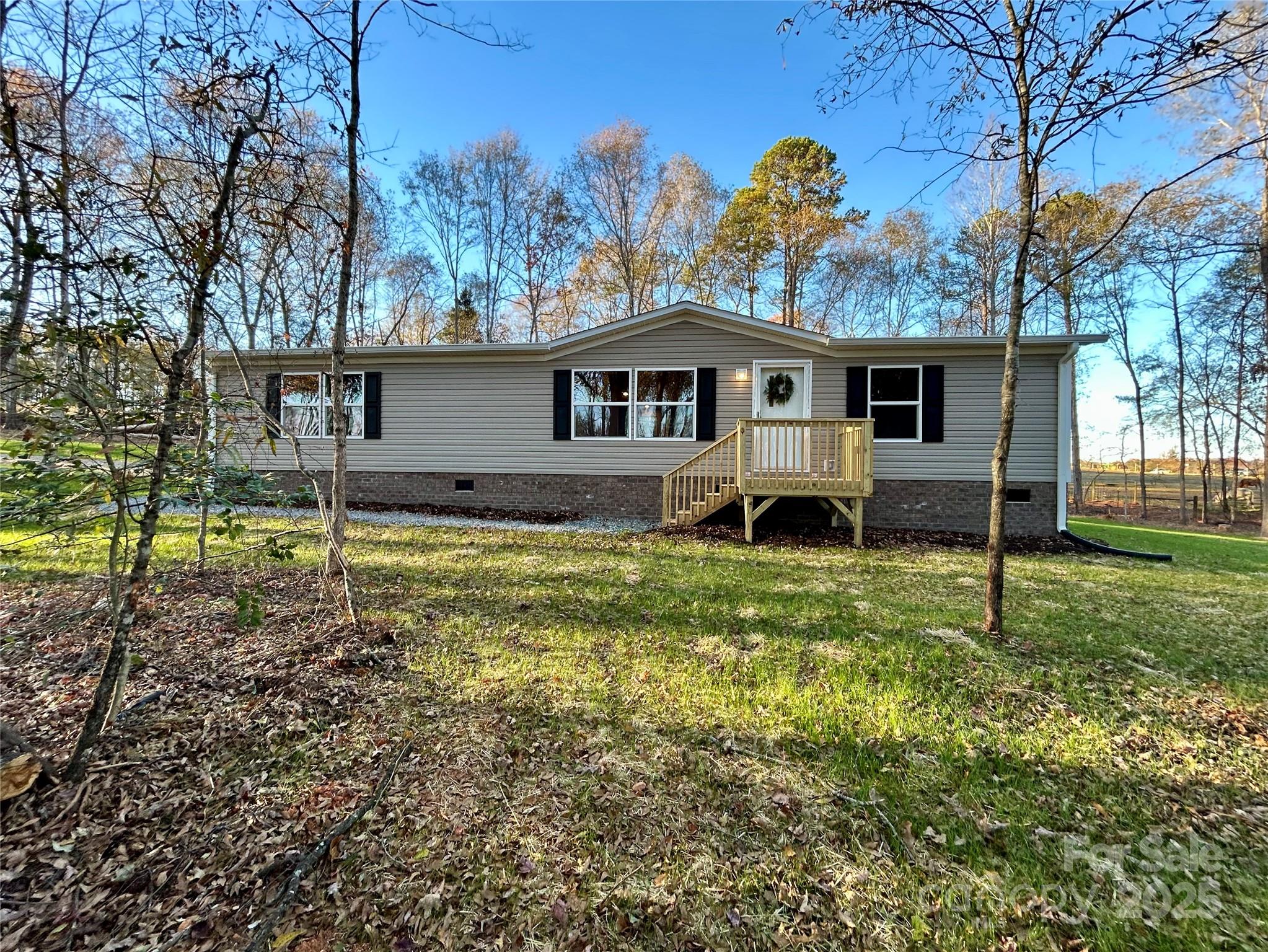 3336 Cliffside Road Mooresboro, NC 28114 - Photo 2 of 29 a house view with a garden space