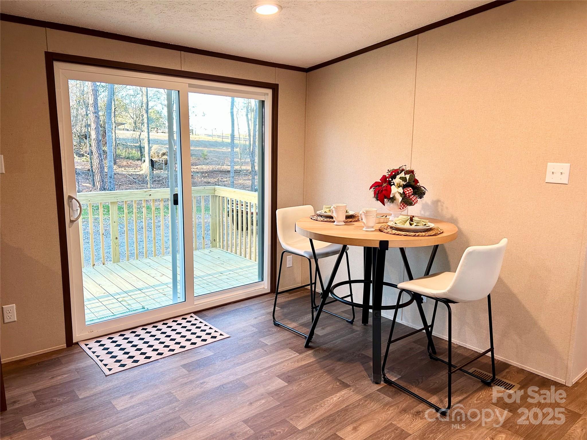 3336 Cliffside Road Mooresboro, NC 28114 - Photo 23 of 29 a dining room with furniture and wooden floor