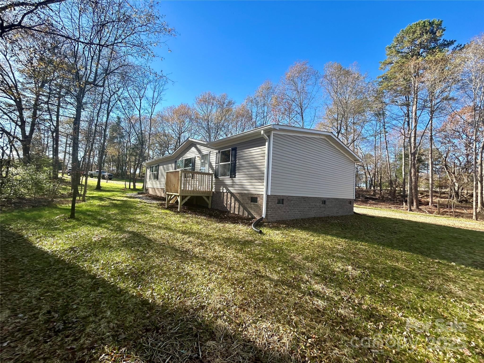 3336 Cliffside Road Mooresboro, NC 28114 - Photo 8 of 29 a house with trees in the background