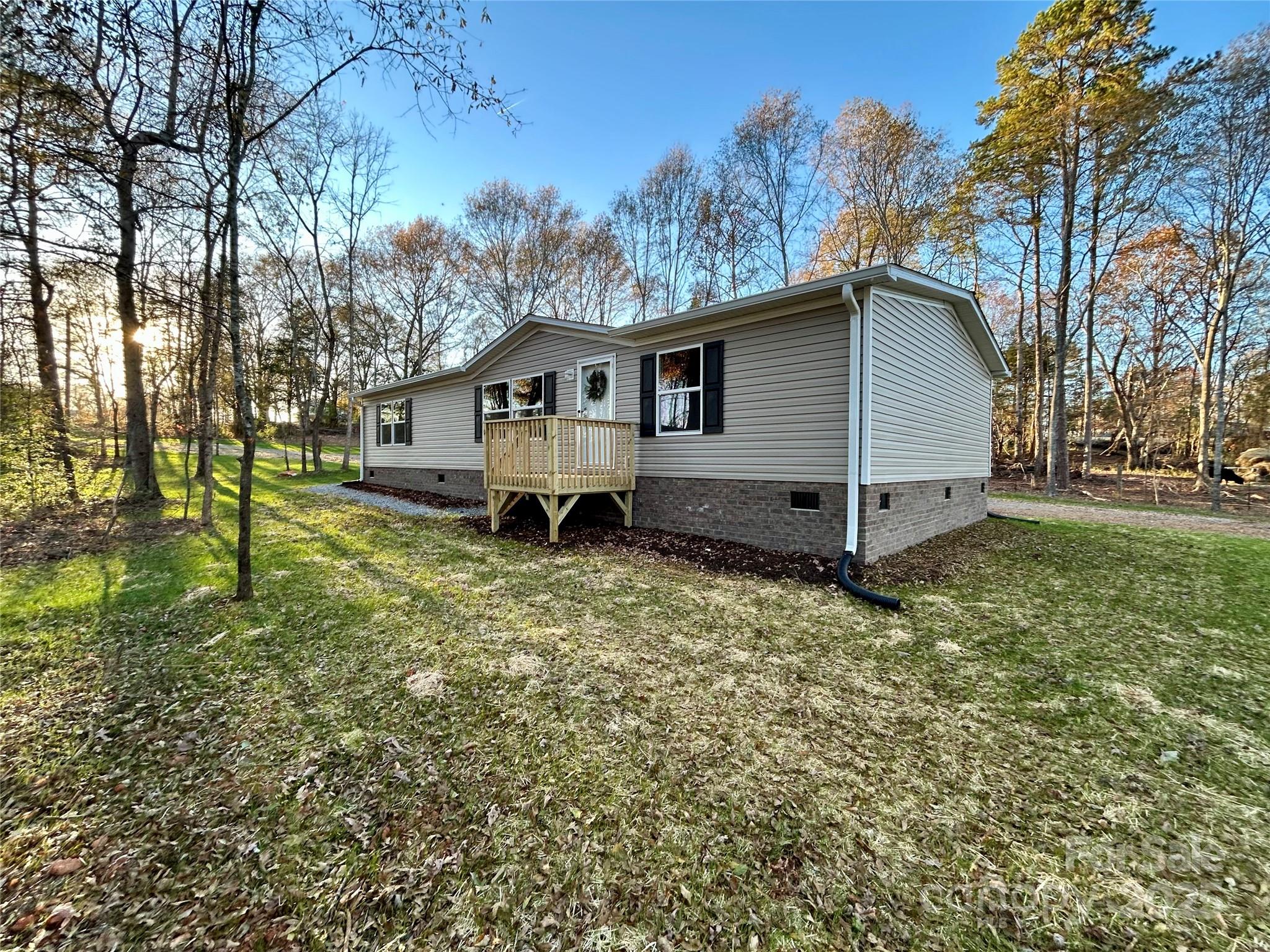 3336 Cliffside Road Mooresboro, NC 28114 - Photo 9 of 29 a house view with a garden space