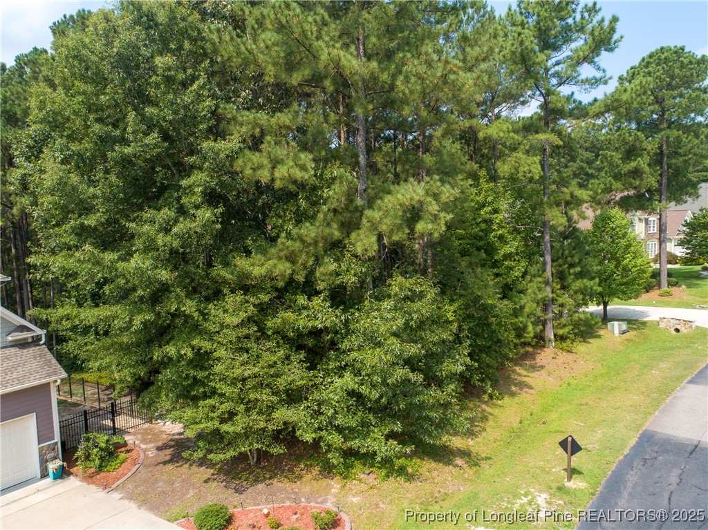 a view of a yard with swimming pool