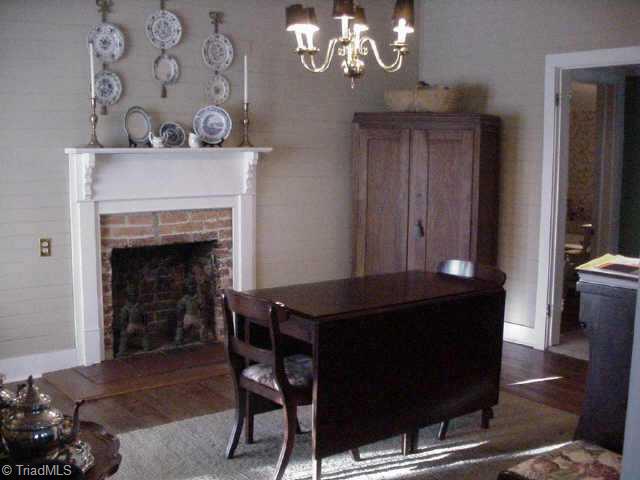 6406 Monnett Road Climax, NC 27233 - Photo 4 of 8 Other. Dining room with fireplace