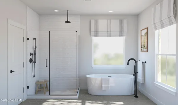 a bathroom with a bathtub and a shower