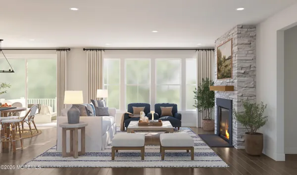 a living room with fireplace furniture and a large window