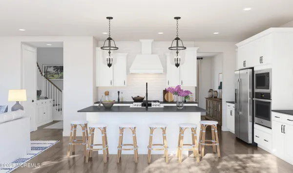 a kitchen with kitchen island granite countertop a table and chairs in it