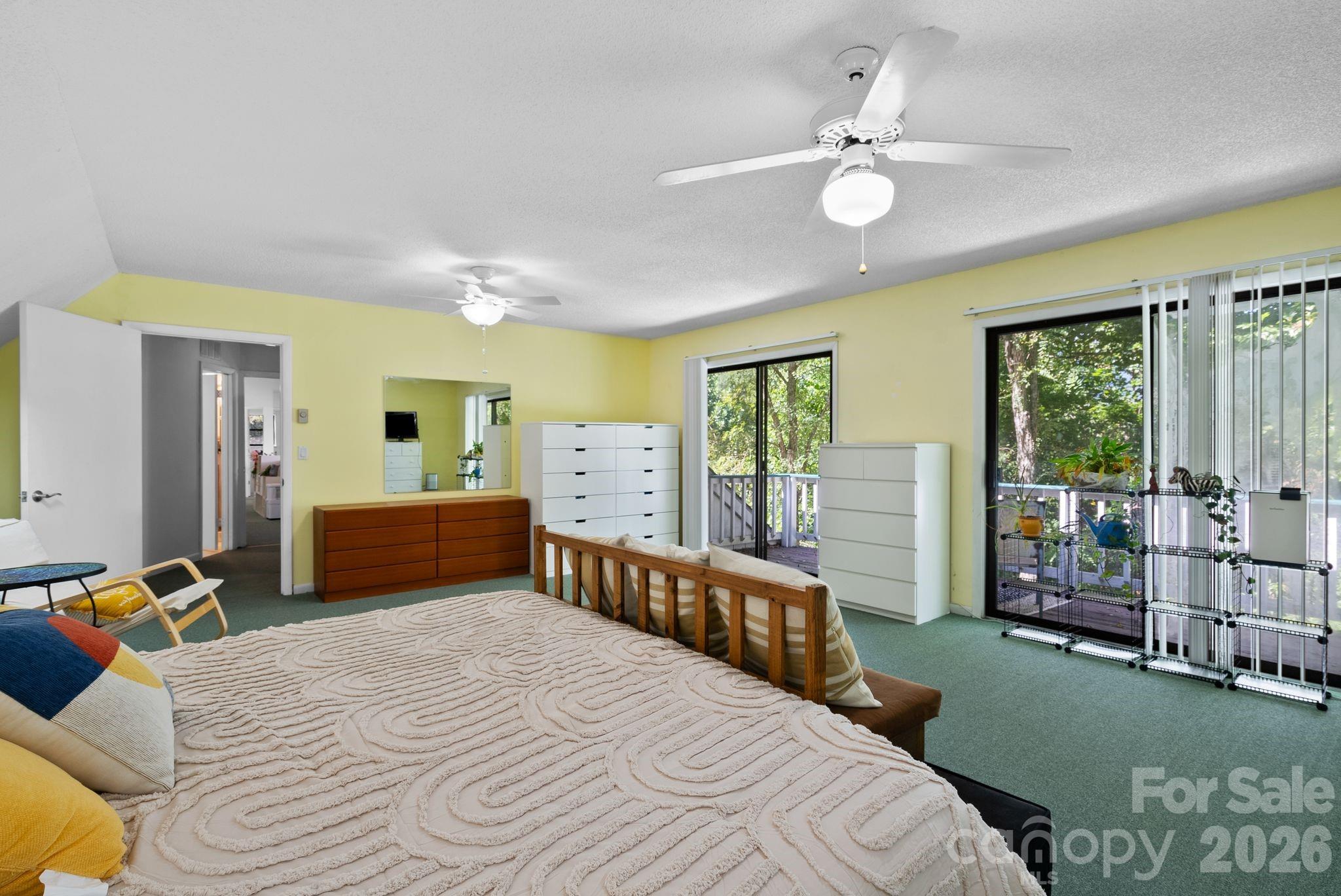 53 Hackberry Lane Waynesville, NC 28785 - Photo 14 of 40 a bedroom with a bed chandelier and a window