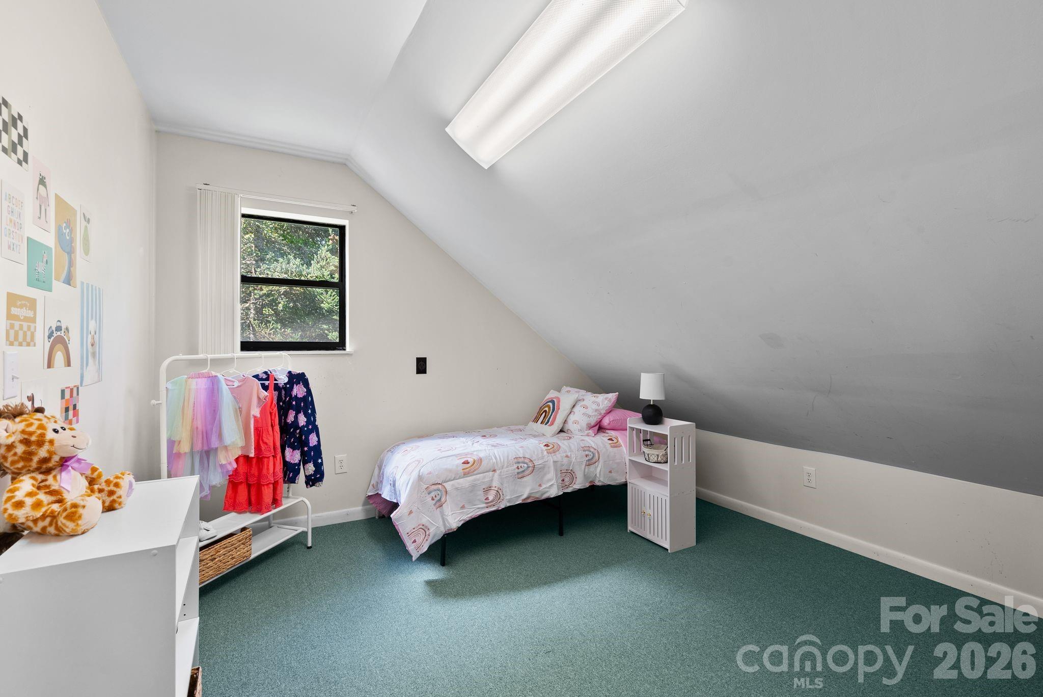 53 Hackberry Lane Waynesville, NC 28785 - Photo 18 of 40 a bedroom with a bed and a cabinet