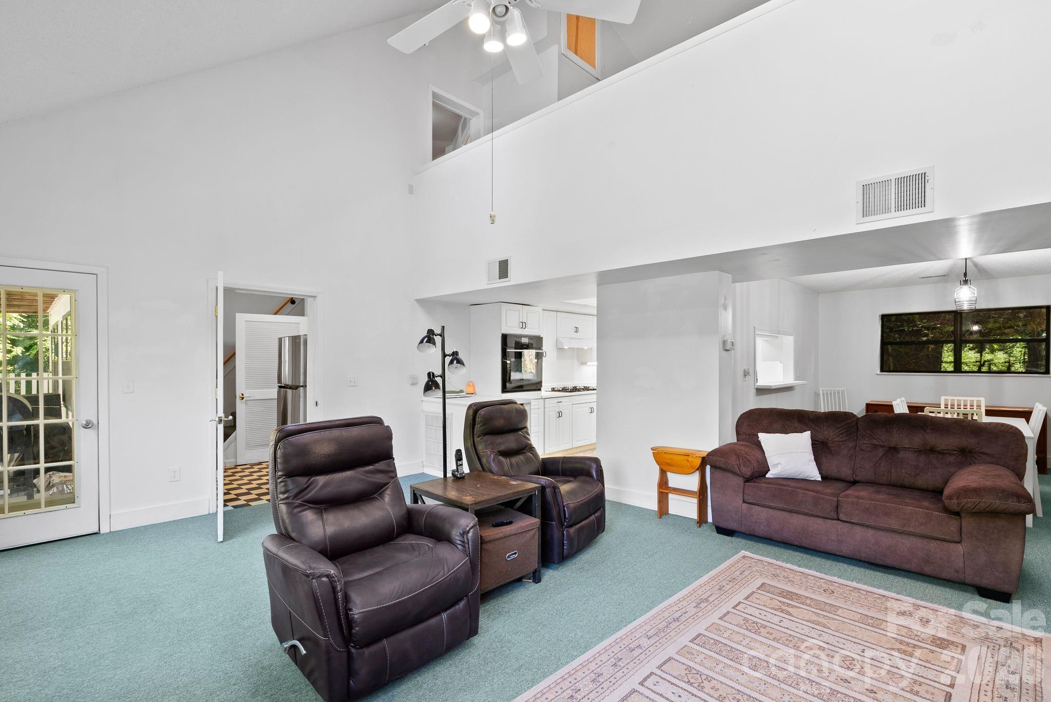 53 Hackberry Lane Waynesville, NC 28785 - Photo 26 of 40 a living room with furniture and a flat screen tv