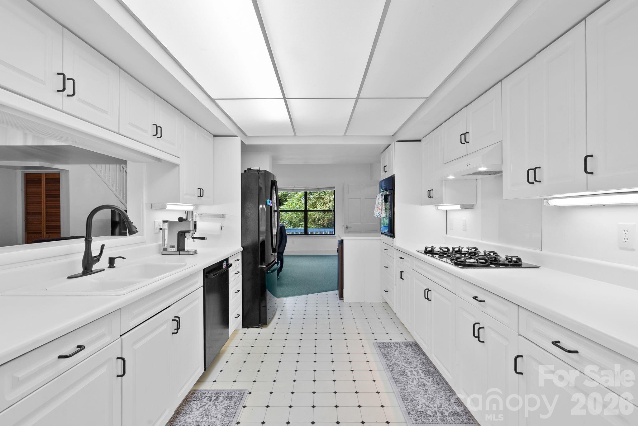 53 Hackberry Lane Waynesville, NC 28785 - Photo 28 of 40 a large white kitchen with a large window