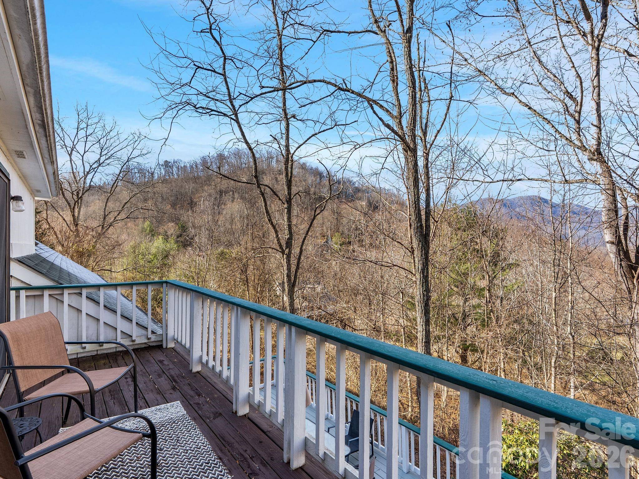 53 Hackberry Lane Waynesville, NC 28785 - Photo 3 of 40 a view of a balcony with wooden fence and floor