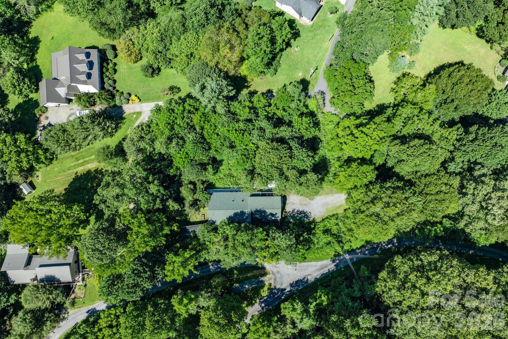 53 Hackberry Lane Waynesville, NC 28785 - Photo 39 of 40 an aerial view of a house with a yard