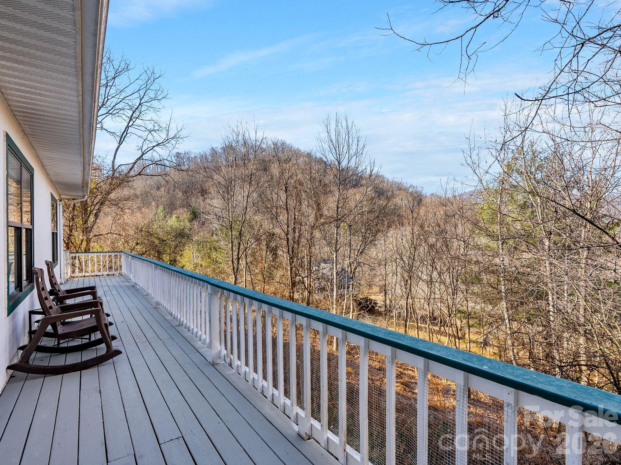 53 Hackberry Lane Waynesville, NC 28785 - Photo 5 of 40 a view of balcony with wooden floor and fence