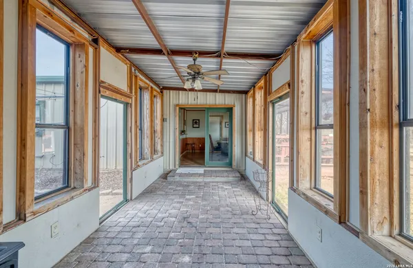 a large kitchen with a table and chairs