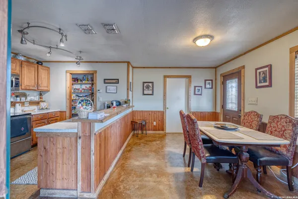a view of a living room and a kitchen