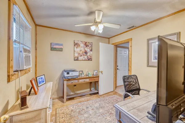 a view of a kitchen with a sink and a window