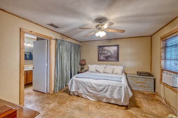 a bathroom with a sink toilet mirror vanity and shower