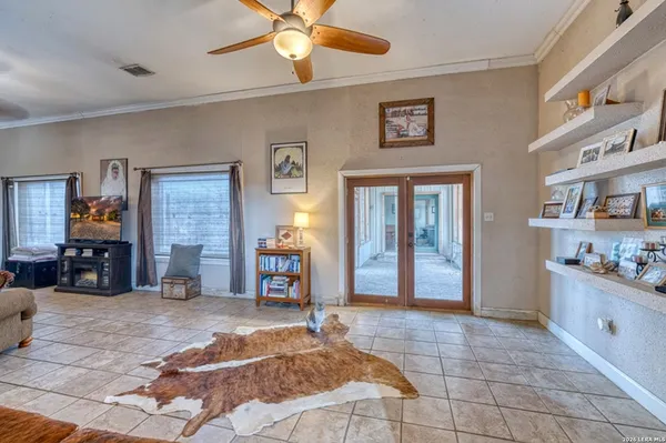 a bedroom with furniture and a book shelf