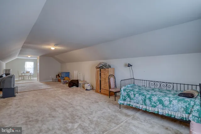 a view of a livingroom with furniture and a gym