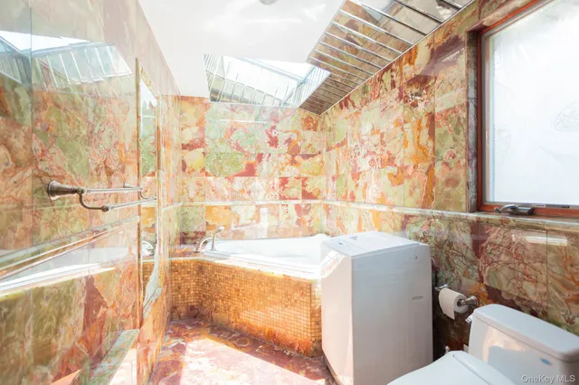 a bathroom with a bathtub and shower