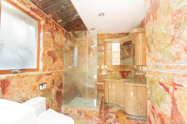 a bathroom with a bathtub and shower