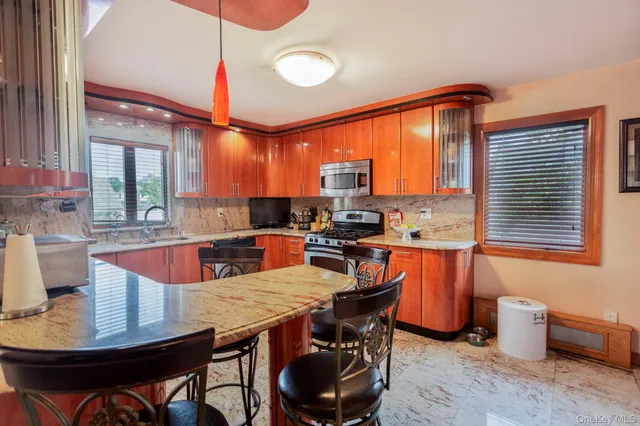 a view of a dining room with furniture and window