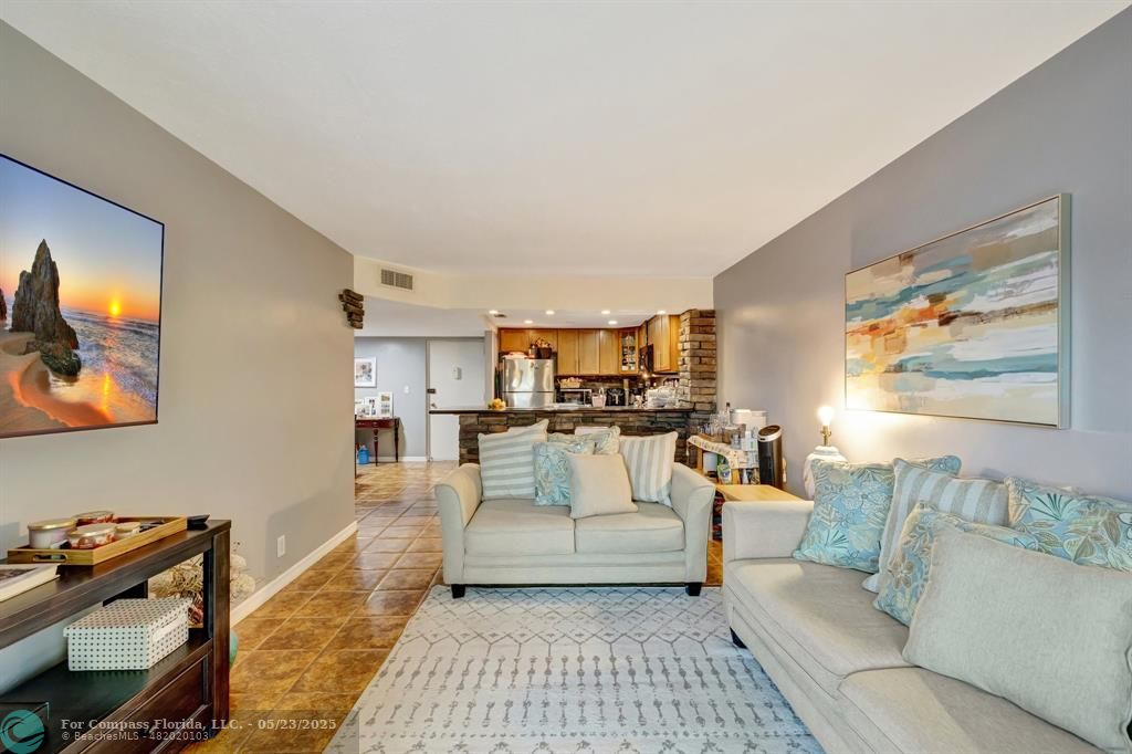 3004 Northeast 5th Terrace, Unit 208C Wilton Manors, FL 33334 - Photo 20 of 63 a living room with furniture and a couch
