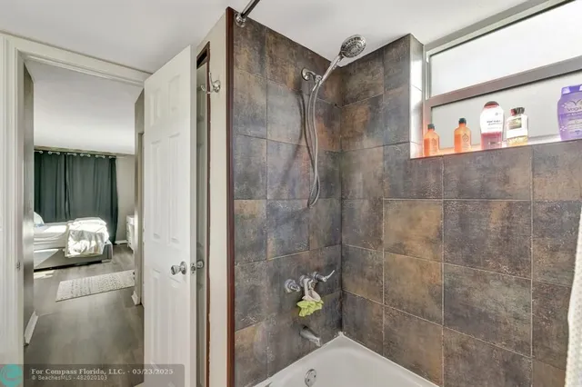 a room with sink and mirror