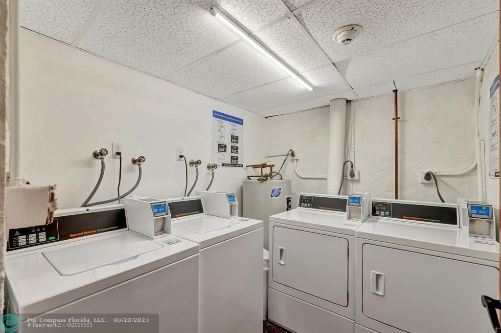3004 Northeast 5th Terrace, Unit 208C Wilton Manors, FL 33334 - Photo 32 of 63 a room with sink and mirror