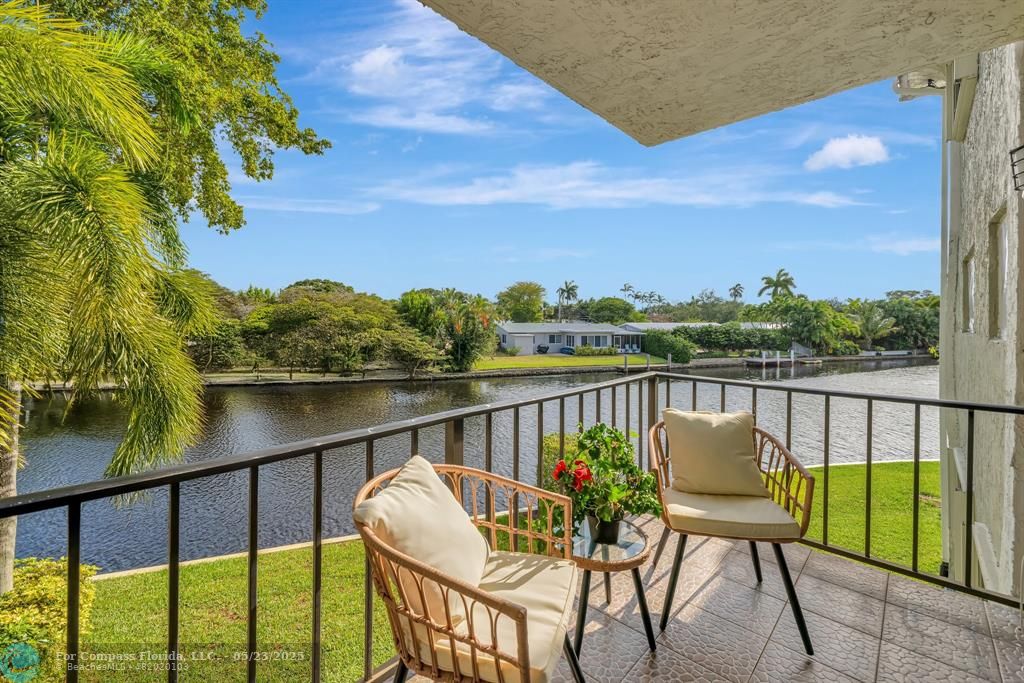 3004 Northeast 5th Terrace, Unit 208C Wilton Manors, FL 33334 - Photo 36 of 63 a view of a chairs and table in the balcony
