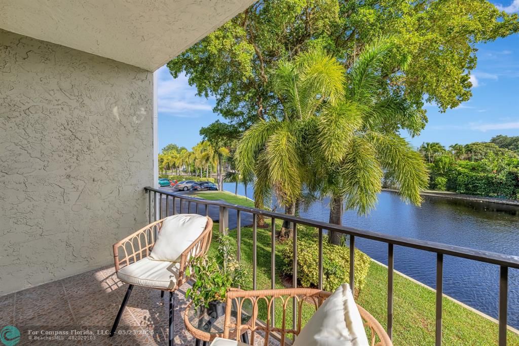 3004 Northeast 5th Terrace, Unit 208C Wilton Manors, FL 33334 - Photo 38 of 63 a view of a chair and table in patio