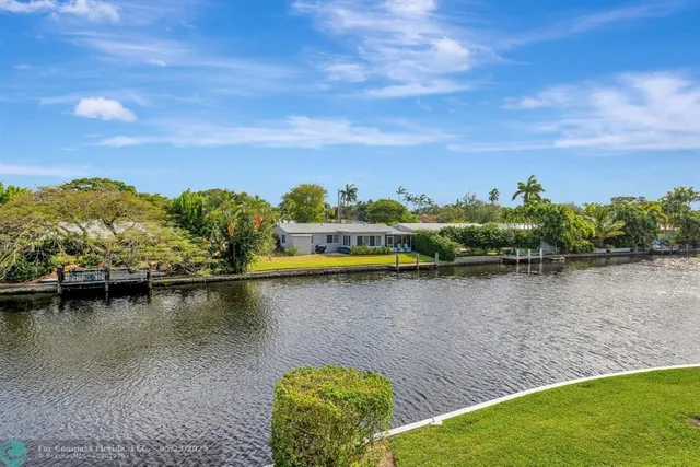 a swimming pool with outdoor seating and yard