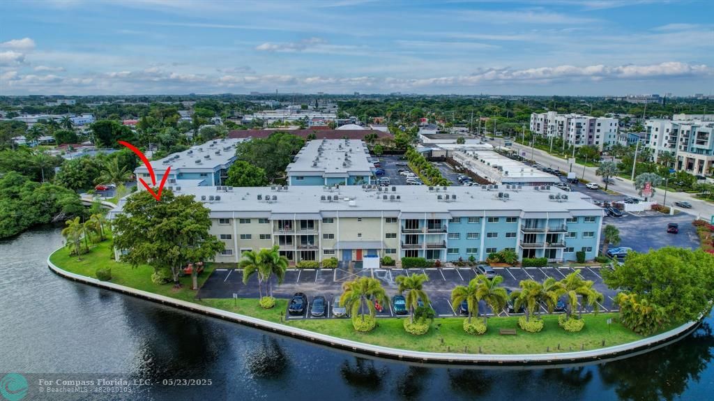 3004 Northeast 5th Terrace, Unit 208C Wilton Manors, FL 33334 - Photo 53 of 63 a view of a city from a balcony