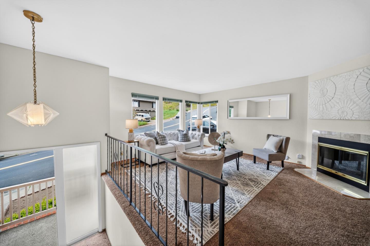 1287 Lerida Way Pacifica, CA 94044 - Photo 15 of 52 a living room with furniture a fireplace and a flat screen tv