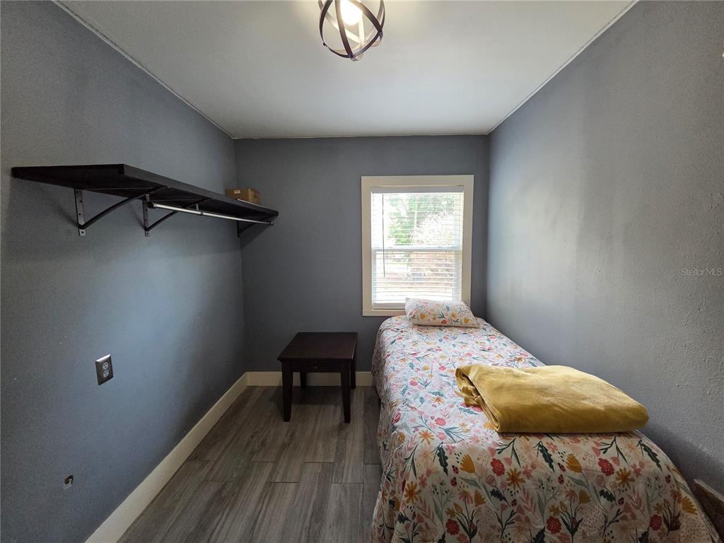 124 East F Street Frostproof, FL 33843 - Photo 21 of 37 a bedroom with a bed and a window