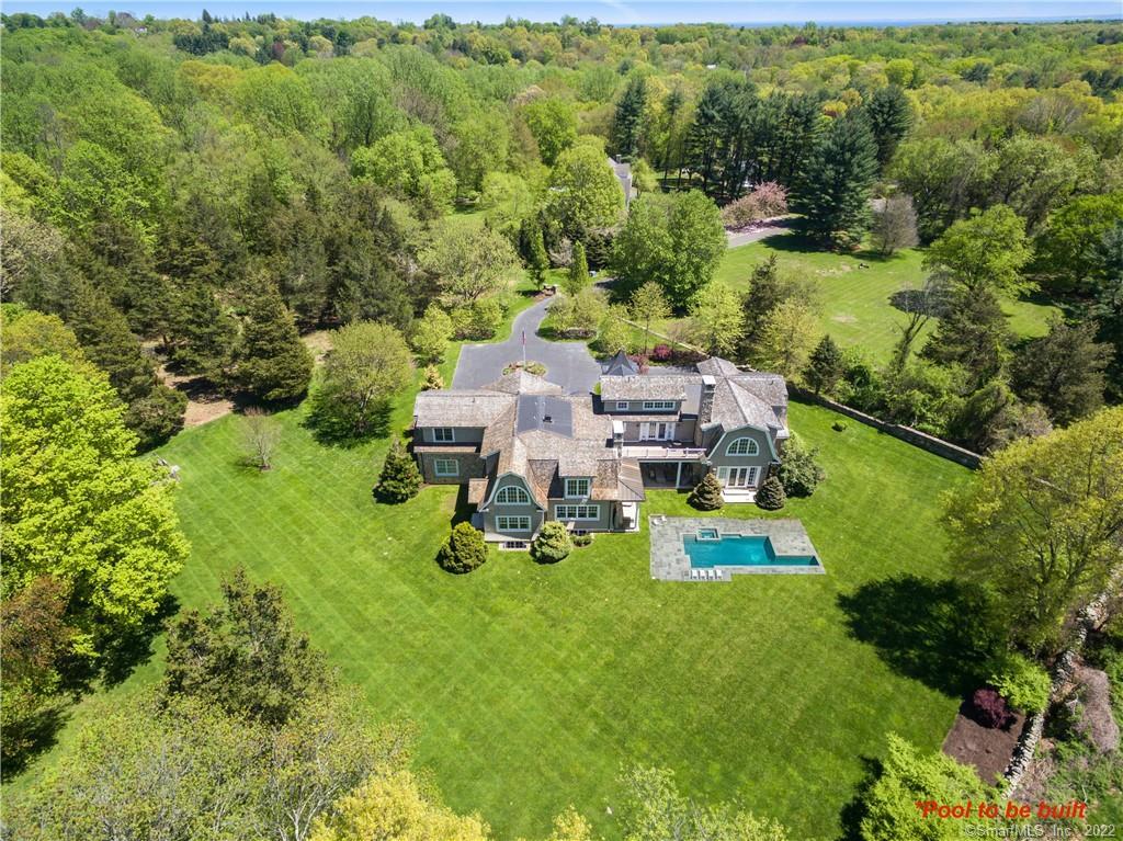 Privately tucked back on end of a cul de sac, 289 Fair Oak Drive was thoughtfully designed & sited with privacy and views in mind.